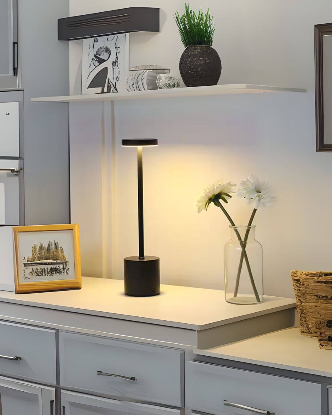 LumiHikari Scandinavian Lamp with sleek black metal design, warm ambient light on white desk with decorative items