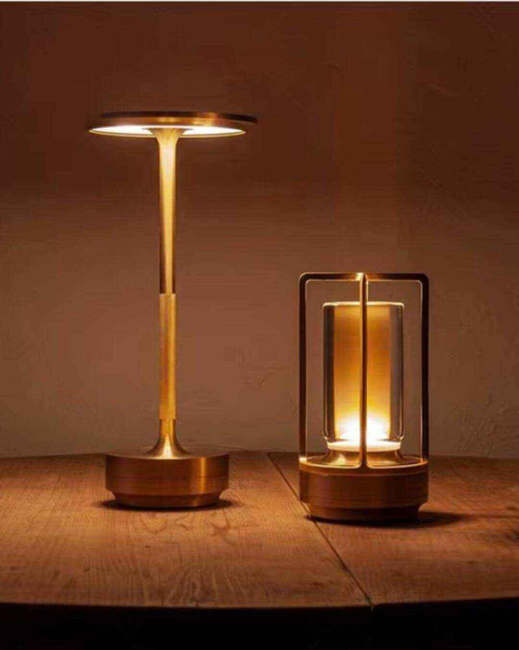 Modern LumiHikari Base Lamp with brushed metal finish providing warm ambient light on wooden surface