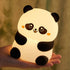 Hand holding a cute glowing cute panda night light LED squishy tap lamp for kids and girls